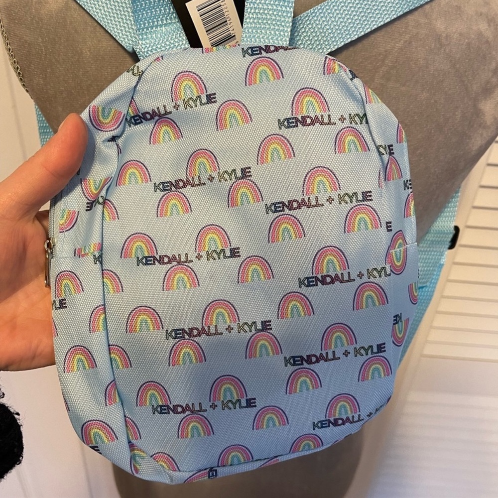 Kendall & Kylie mini backpack. Light blue with rainbows and k&k logo. NWT